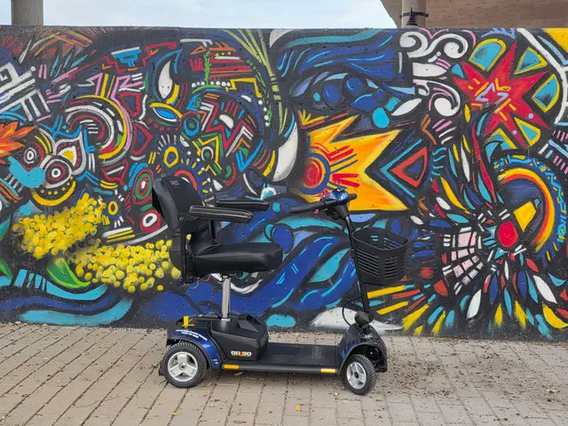 Accessible visit to an abstract mural with a mobility scooter rental, Kansas City