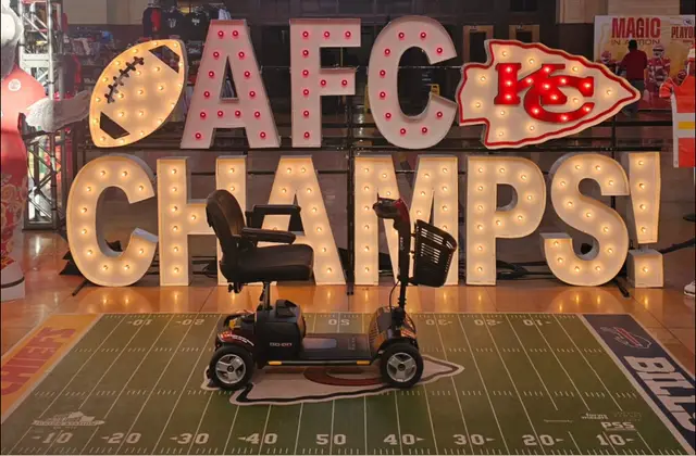 Mobility scooter rental at AFC Champs marquee letters, Kansas City