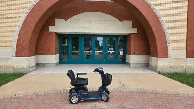 Mobility scooter from KC Mobility at a civic building entrance in Kansas City