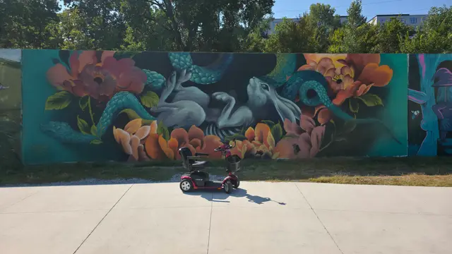 Mobility scooter rental at a coral reef mural, Kansas City