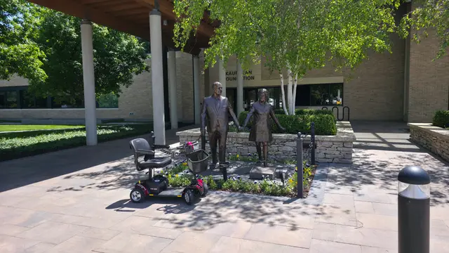 Mobility scooters on location at a figure sculpture group, Kansas City