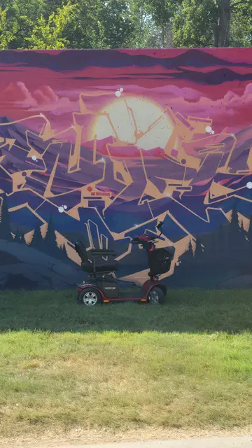 Mobility scooter from KC Mobility at a geometric abstract mural in Kansas City
