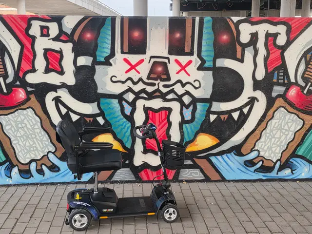 Mobility scooter rental on location at a graffiti face mural, Kansas City