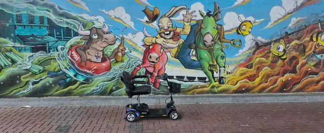 Mobility scooter rental at a graffiti mural, Kansas City