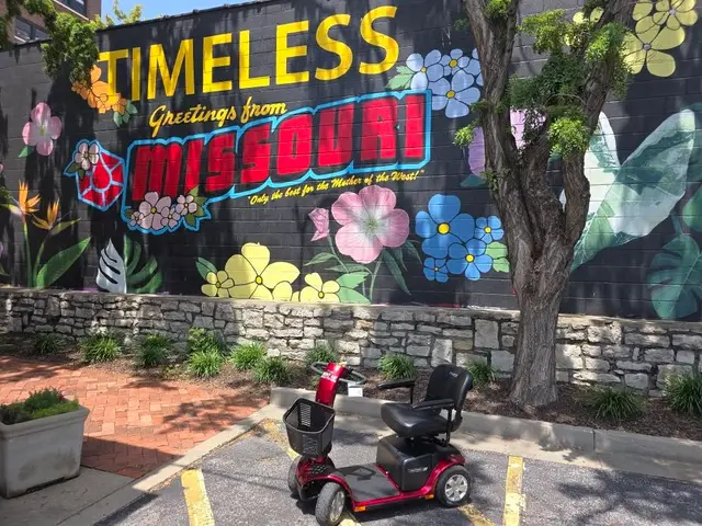 Mobility scooter rental at Greetings from Missouri mural, Kansas City
