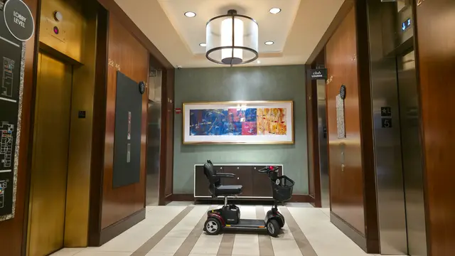 Mobility scooter rental delivered to a hotel elevator lobby, Kansas City