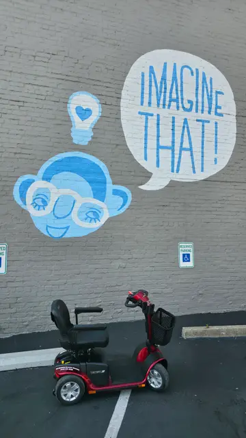 Mobility scooter rental at Imagine That cloud mural, Kansas City