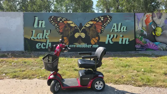 Mobility scooter from KC Mobility at In Lak'ech Ala K'in butterfly mural in Kansas City