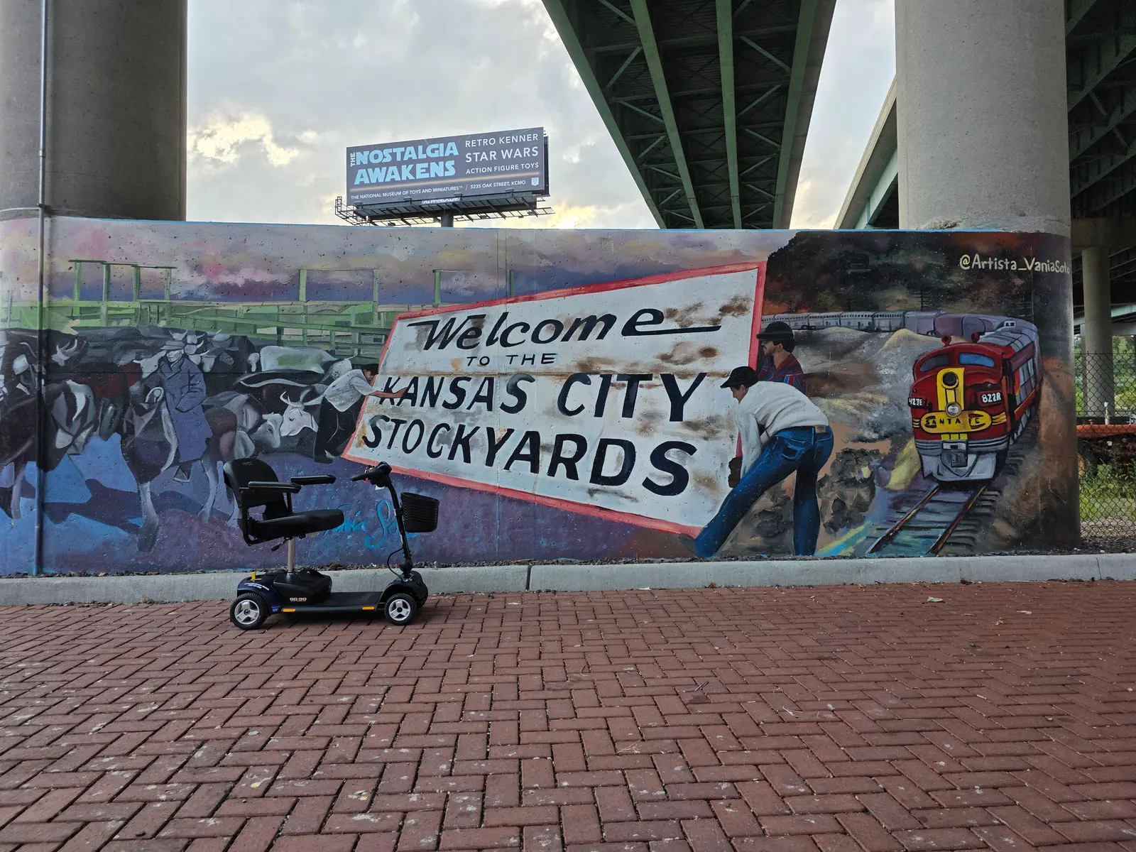 Mobility scooter rental at the Welcome to the Kansas City Stockyards mural