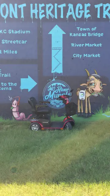 Mobility scooter rental at KC River Murals sign, Kansas City