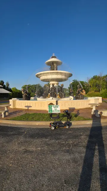 Mobility scooters at Legends fountain sculpture, Kansas City, KS
