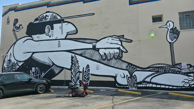 Mobility scooter from KC Mobility at a line drawing mural in Kansas City