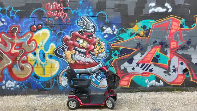 Mobility scooter rental at a monster burger mural, Kansas City