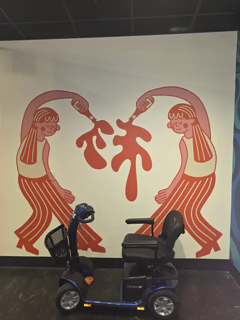 Mobility scooter rental on location at Museum of BBQ mural, Kansas City