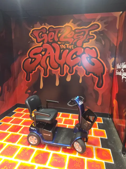 Mobility scooter from KC Mobility at Museum of BBQ Sauce mural in Kansas City