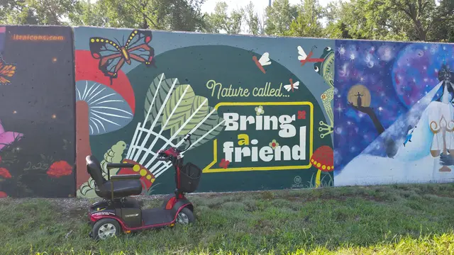 Mobility scooter rental at Nature Called Bring a Friend mural, Kansas City