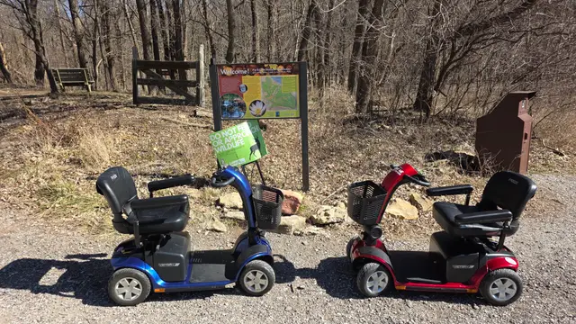 Mobility scooters at a nature trail boardwalk, Kansas City