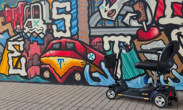 Mobility scooter rental on location at a painted car mural, Kansas City