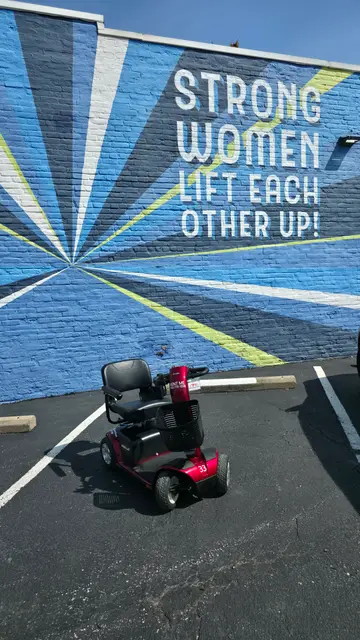 Mobility scooter rental at a painted crosswalk, Kansas City