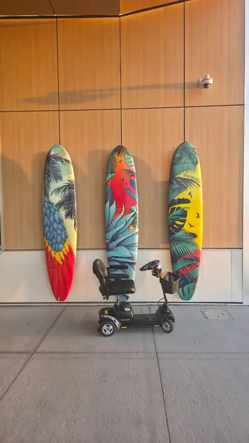Accessible visit to a painted surfboards with a mobility scooter rental, Kansas City