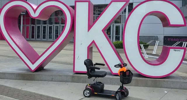 Mobility scooter from KC Mobility at Pink heart KC sign in Kansas City
