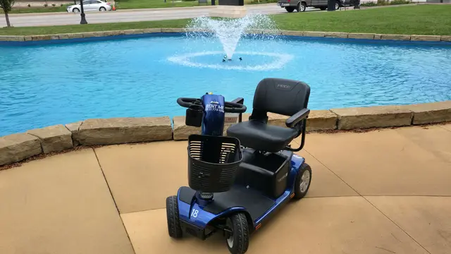 Mobility scooter rental at Plaza fountain, Kansas City (scooter at fountain pool)