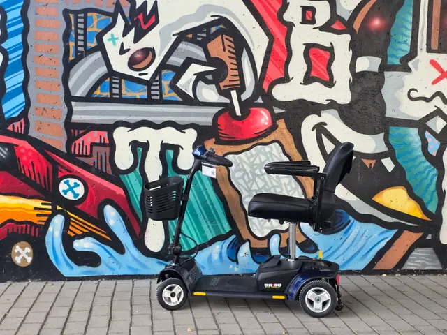 Mobility scooter from KC Mobility at a pop art mural in Kansas City