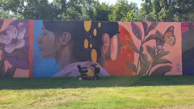 Accessible visit to a portrait and flowers mural with a mobility scooter rental, Kansas City