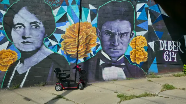 Mobility scooter rental at a portrait mural with sunflowers, Kansas City