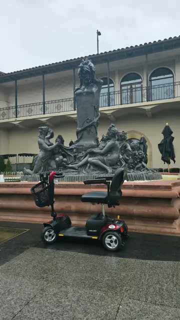 Mobility scooter rental at a reclining figure sculpture, Kansas City
