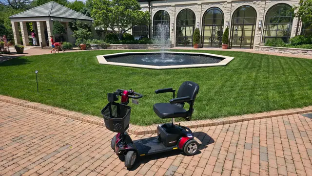 Accessible visit to a reflecting pool fountain with a mobility scooter rental, Kansas City