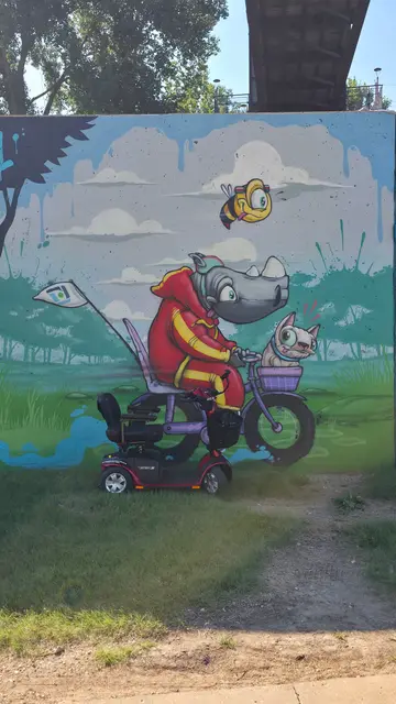 Mobility scooter from KC Mobility at a rhino on bicycle mural in Kansas City