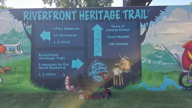 Mobility scooter rental on location at Riverfront Heritage Trail sign, Kansas City