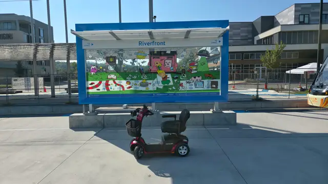 Mobility scooter from KC Mobility at Riverfront interpretive panel in Kansas City