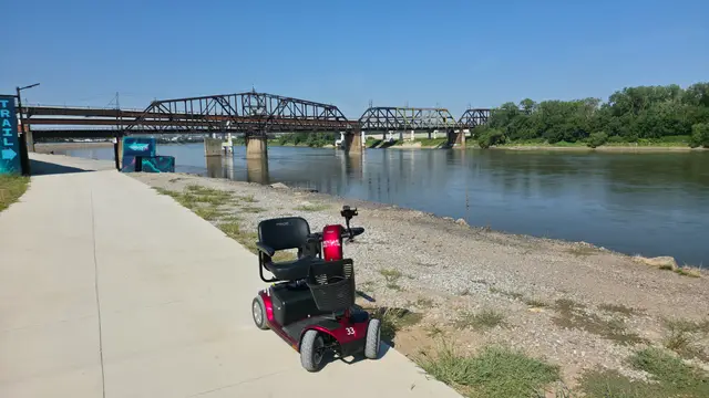 Mobility scooter rental on location at Riverfront path at bridge, Kansas City