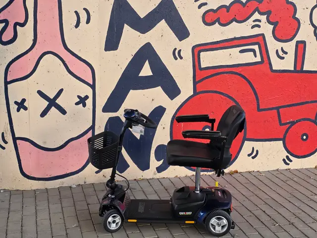Mobility scooter rental at a skull and man mural, Kansas City