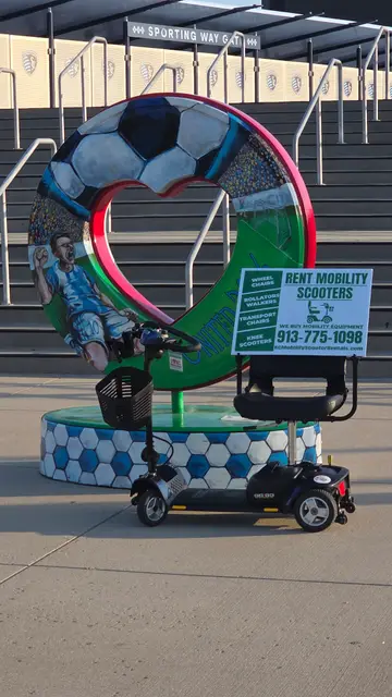 Mobility scooter from KC Mobility at a soccer heart sculpture in Kansas City