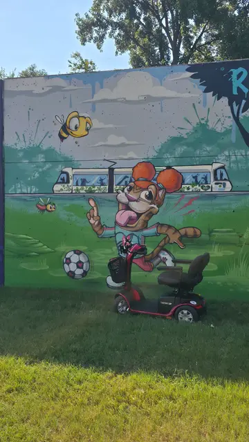 Accessible visit to a soccer squirrel mural with a mobility scooter rental, Kansas City