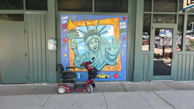 Mobility scooter rental on location at Statue of Liberty mural, Kansas City