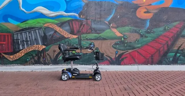 Accessible visit to a street mural with a mobility scooter rental, Kansas City