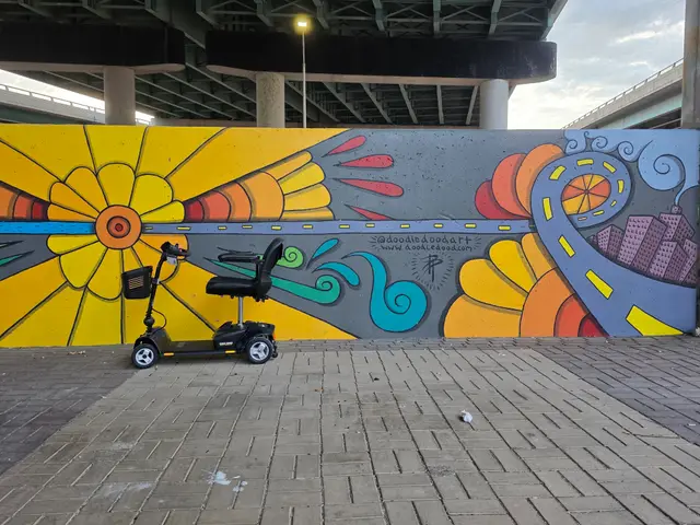 Mobility scooter rental at a sunburst mural, Kansas City
