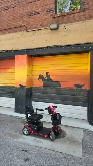 Mobility scooter rental on location at a sunset horse mural, Kansas City