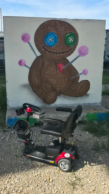 Mobility scooter rental at a teddy bear mural, Kansas City