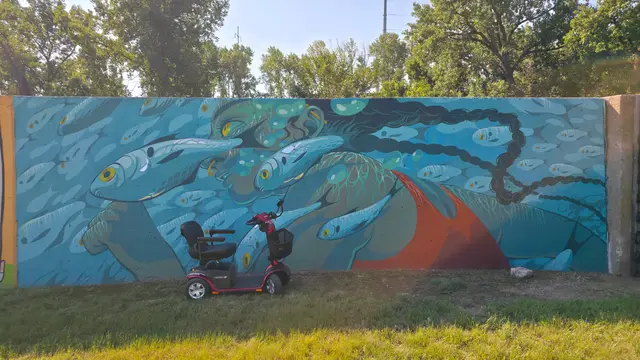 Accessible visit to an underwater fish mural with a mobility scooter rental, Kansas City