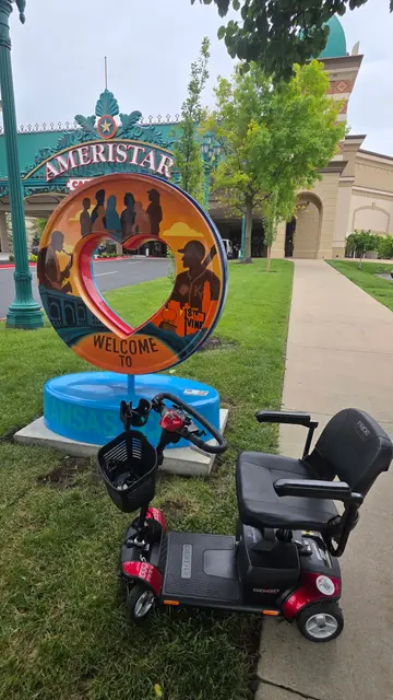 Mobility scooter rental at Welcome KC heart sculpture, Kansas City
