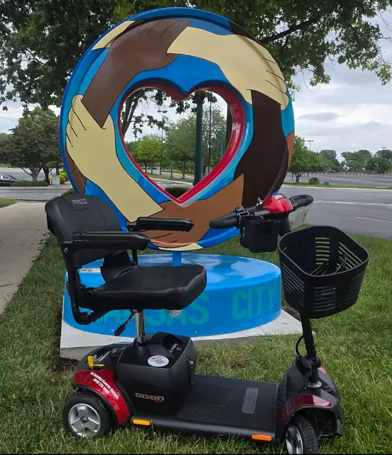 Accessible visit to Welcome to Kansas City heart with a mobility scooter rental, Kansas City